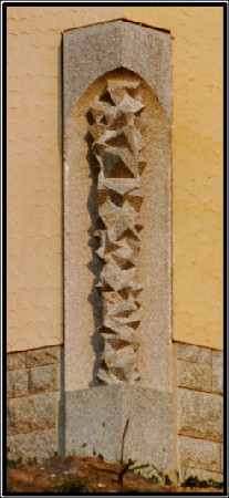 The work VII/4 is a big sculpture from granite over 3 m high. It is the cornerstone of a house.